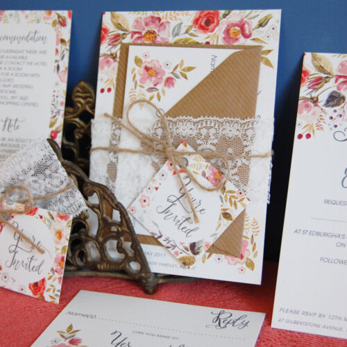 This is the Lydia Spring Floral Wedding Invitation Suite, tied with lace & twine, it's the perfect wedding invitation for a rustic spring wedding.