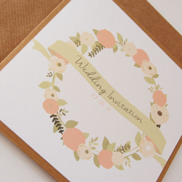 Mabel Floral Pocketfold Wedding Invitation on Kraft Card with Banner Details Front Close Up with pastel floral wreath