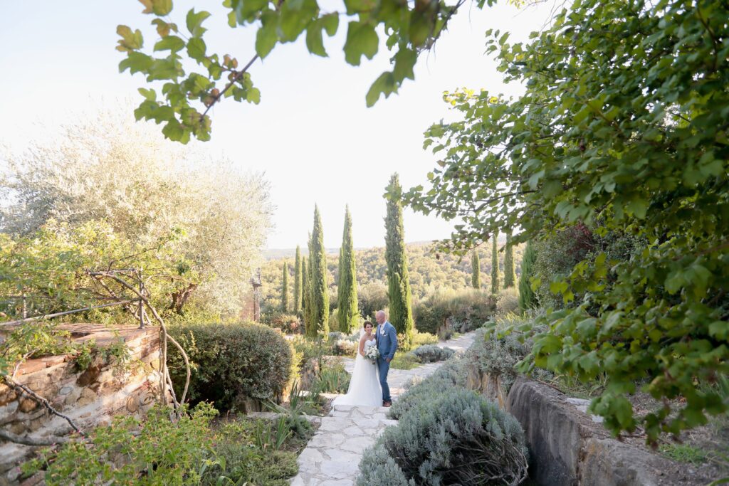 Bride and groom in tuscany hills